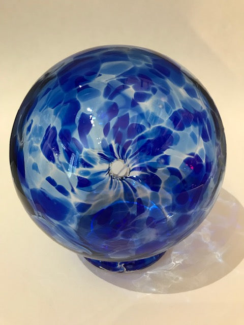 This beautiful blue glass storage bank for wishes, dreams, blessings, and thoughtful ideas includes a notepad of 52 slips of paper on which your treasured thoughts can be recorded and inserted into the wishing ball (or gratitude ball) for safe keeping. Footed glass ball measures approximately 3 and one-half inches in diameter.