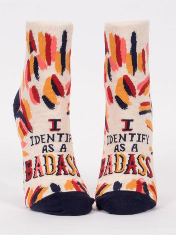 Woman's novelty fun ankle sock with legend: "I Identify As A Badass"