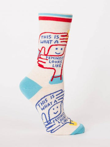 Woman's novelty fun crew sock with legend: "This Is What A Feminist Looks Like"