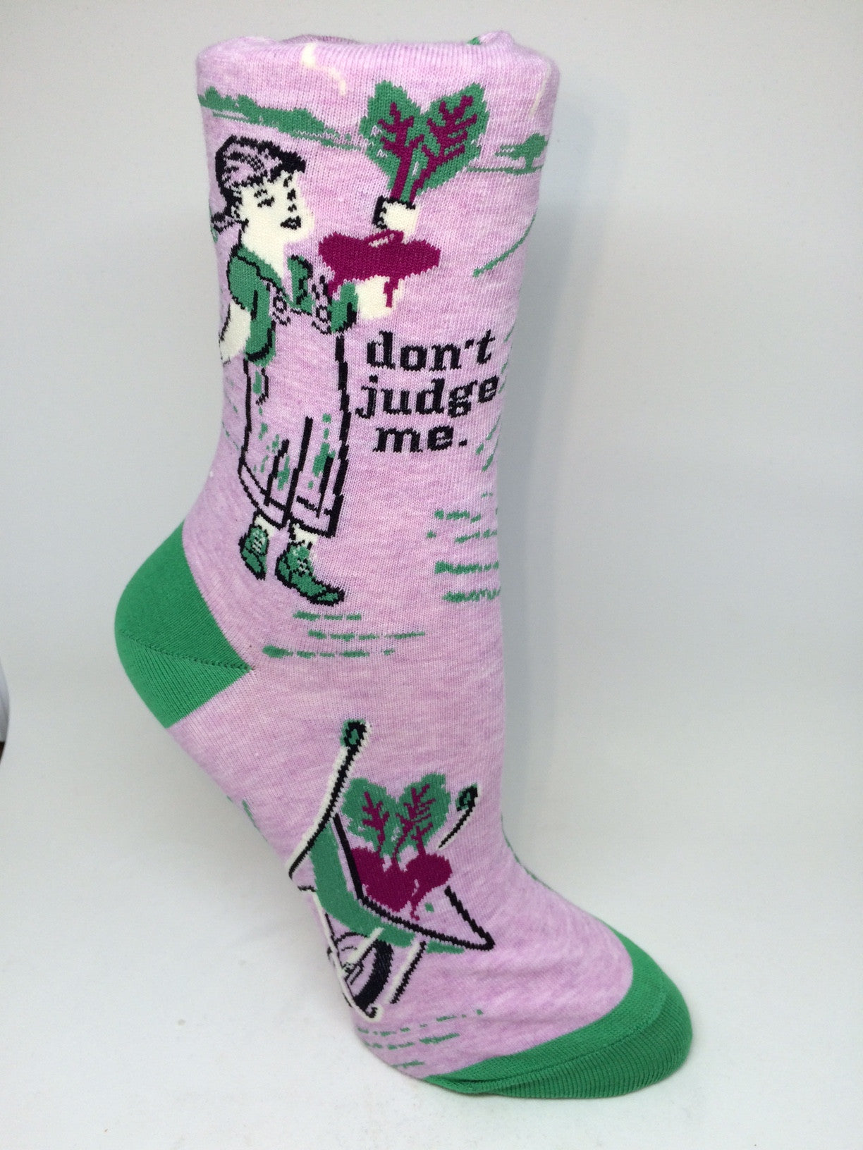 Woman's novelty fun crew sock with legend: "Don't Judge Me"