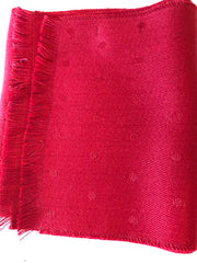 Alpaca fleece is lustrous and silky. It is similar to sheep's wool but it is warmer, not prickly, and contains no lanolin, which makes it hypoallergenic. Alpaca garments are soft and luxurious. This reversible two-sided red scarf is hand-crafted in Peru by native artisans using 50% alpaca and 50% acrylic (for strength)