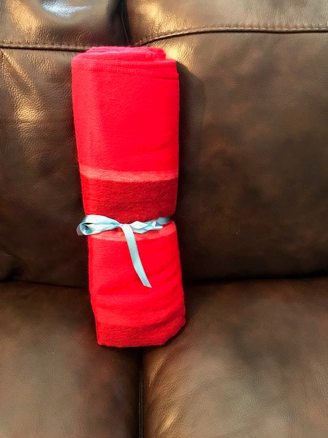 This wonderfully soft & snugly red lap blanket or sofa/chair throw will not only keep you comfortable, but will add color and texture to your decorating scheme. 100% acrylic and 100% hand crafted in Ecuador by native artisans, making it even more beautiful as a Fair Trade item. Measures a generous 61" by 45".