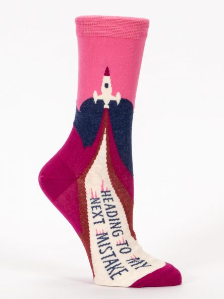 Woman's novelty fun crew sock with legend: "Heading To My Next Mistake"